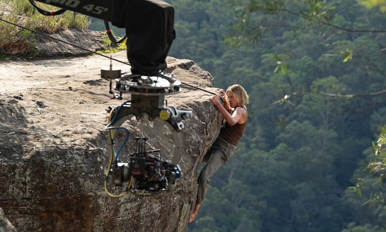 Charlize Theron Climbs a Billboard for Apex: What It Signals