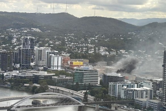 Person rescued from seven-storey building on fire in Brisbane’s inner-west