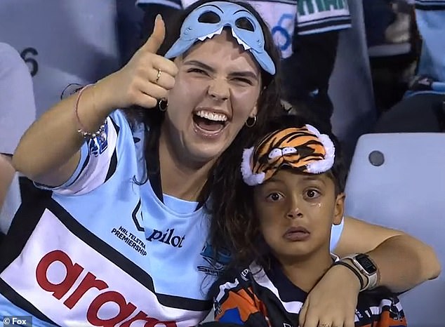 Five-year-old footy fanatic goes viral after being pictured crying his eyes out on TV - as some fans say clip shouldn't have been broadcast