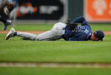 Jax exits after liner hits his back vs. Orioles