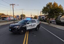 Victims in fatal Lawrence crash both had gunshot wounds, DA says