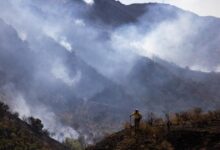 Wind-driven fires burn 20,000 acres as evacuations lift