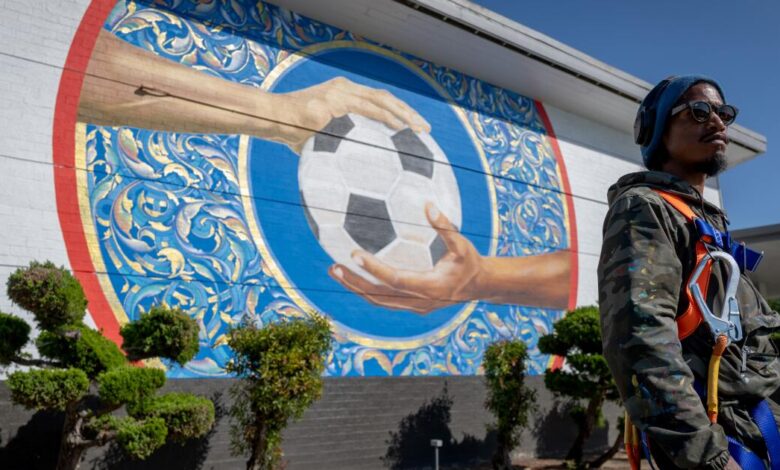 Inglewood artists paint World Cup welcome on school walls