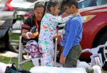 Thousands return as officials keep 16,000 evacuated