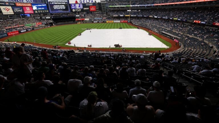 Downpour derails Red Sox-Yankees opener; doubleheader set Downpour derails Red Sox-Yankees opener; doubleheader set