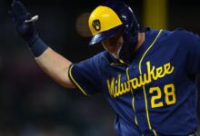 Brewers score eight late, beat Rockies 9-7