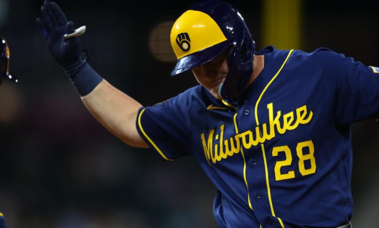 Brewers score eight late, beat Rockies 9-7