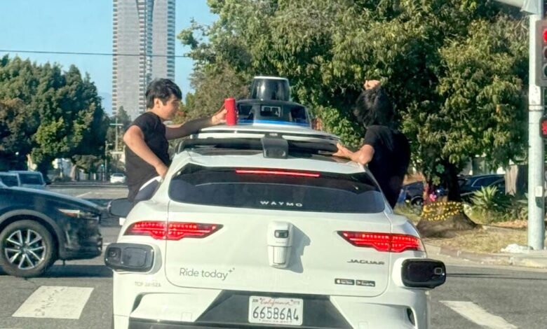 Kids sit on Waymo windows as car speeds on Kids sit on Waymo windows as car speeds on