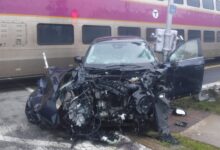 Car drives into moving commuter rail train in Concord