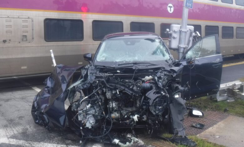 Car drives into moving commuter rail train in Concord