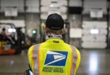 A judge expands a block on U.S. Postal Service work on Trump’s mail-in voting order