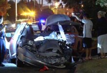 Driver fleeing police smashes into parked cars, shearing roof off a vehicle