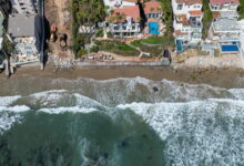 A billionaire was accused of stealing Malibu sand. Now he’s donating a new beach to the public