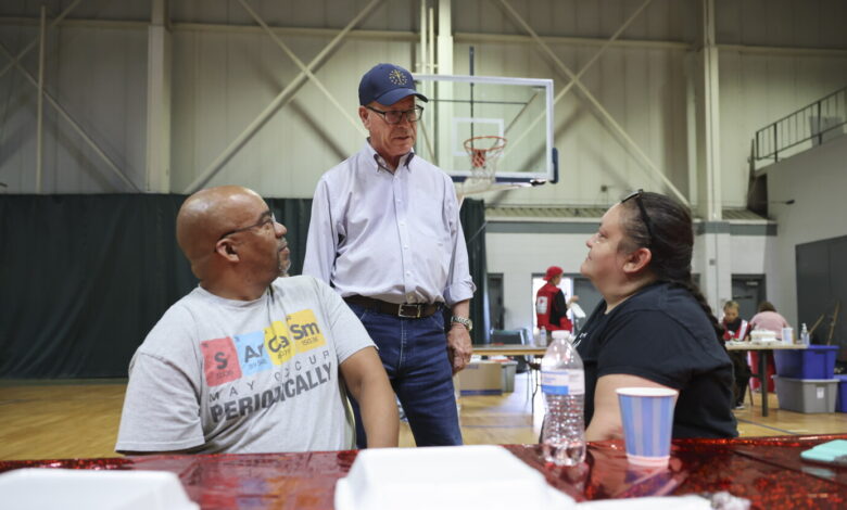 Indiana’s governor demands probe of power utility during tour of storm-ravaged Gary